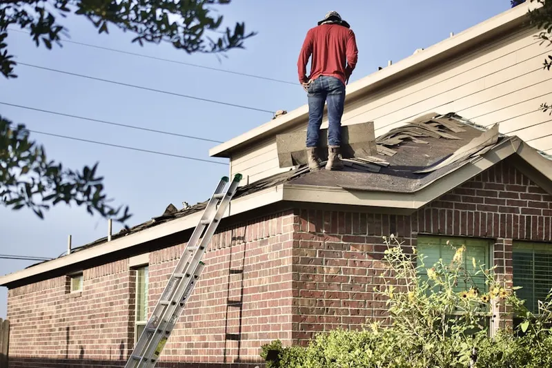 Professional roofer working on a residential roof in Sunny Hills